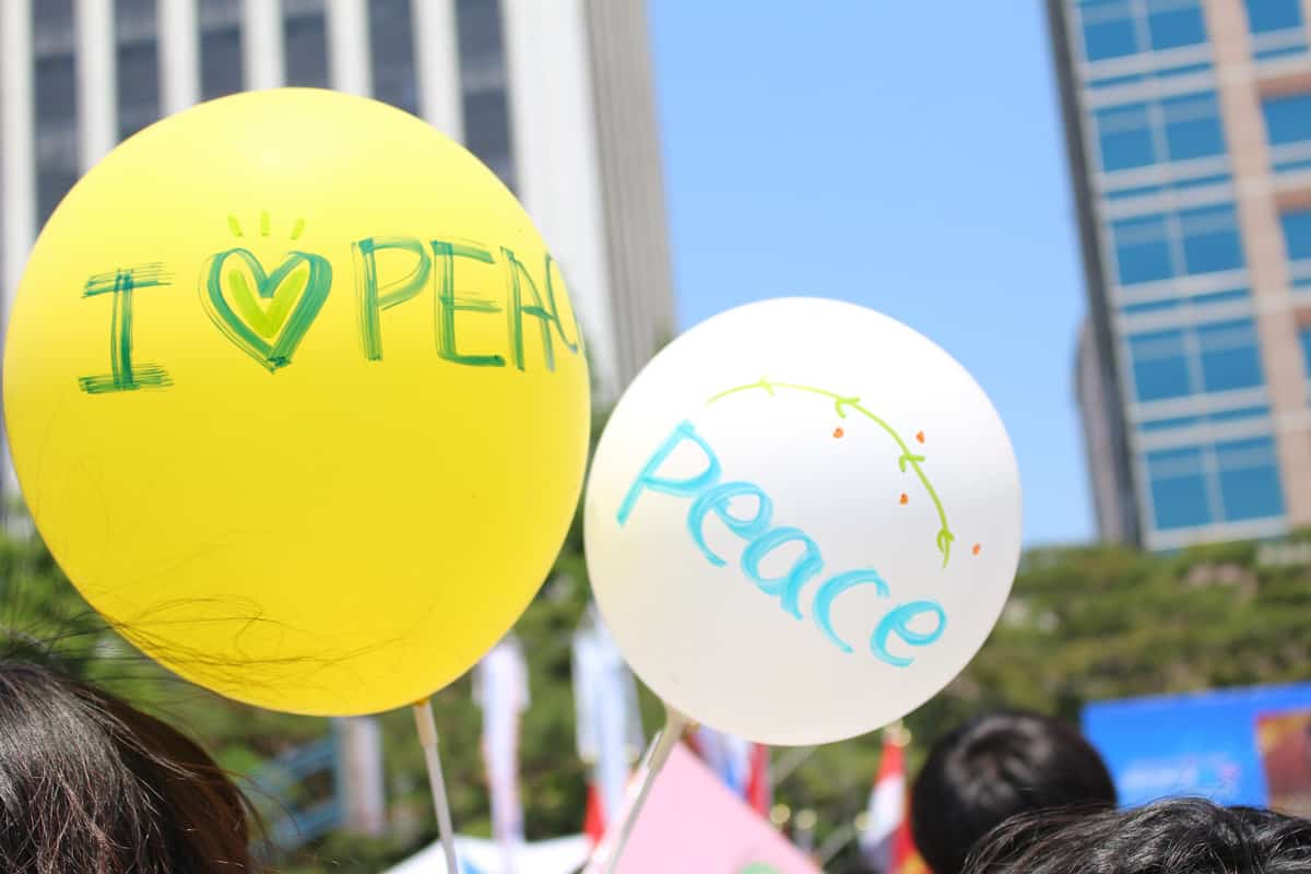 Two balloons with peace written on them