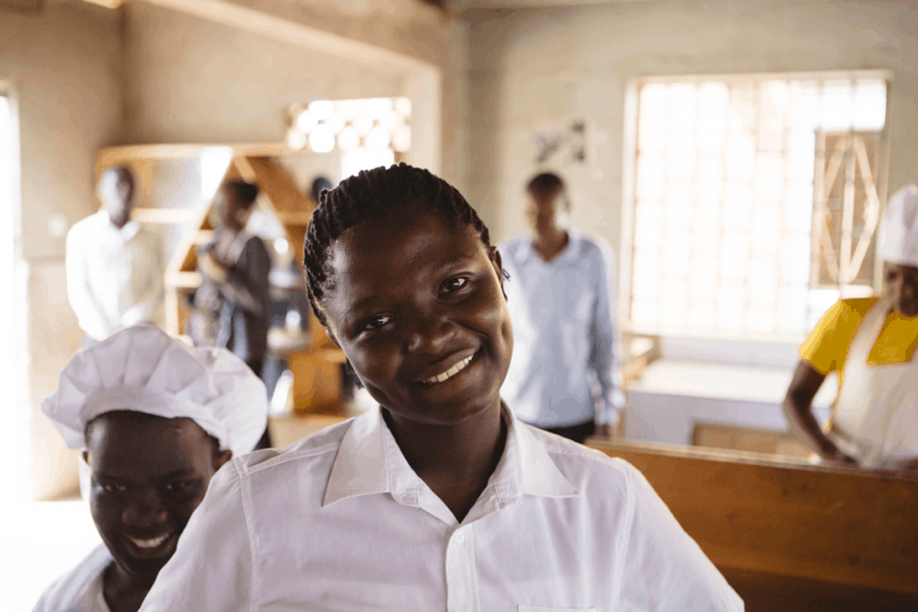 St. Elizabeth Girls Academy culinary student smiling at camera